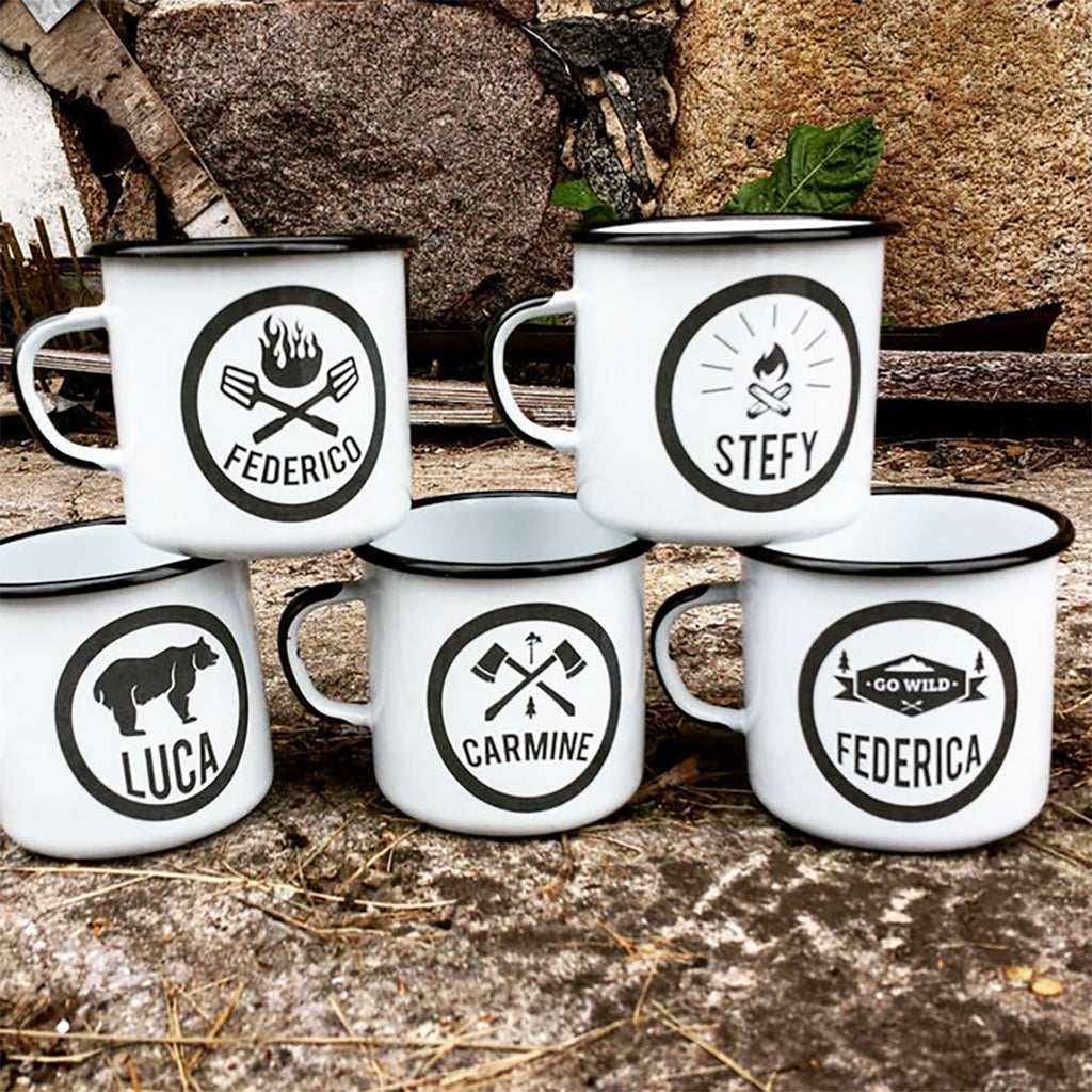 Set of white mugs with personalized names on a rustic background
